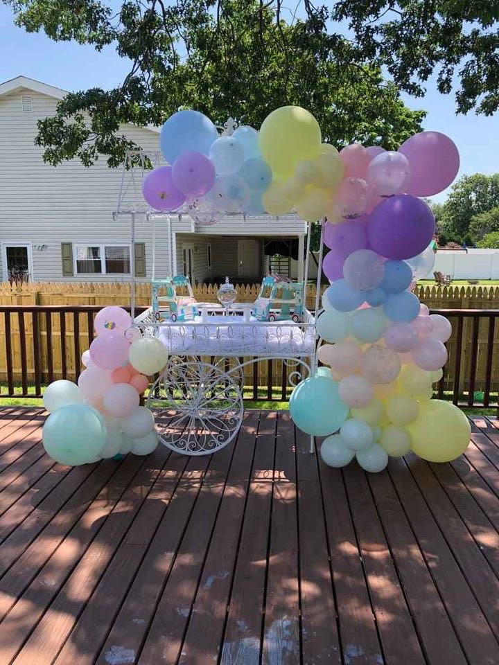 The pastel candy cart by Patchogue Garlands.